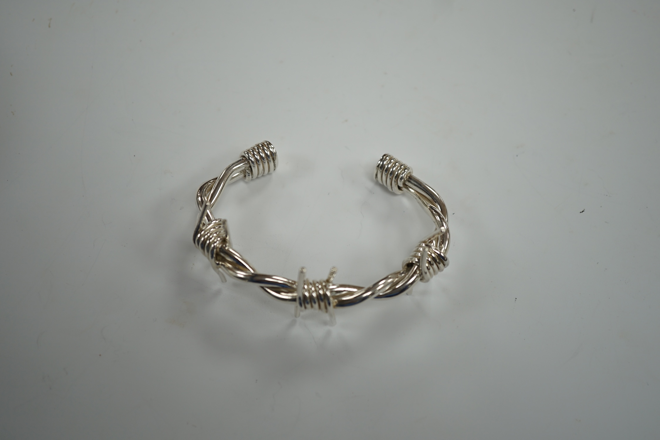 A modern silver 'barbed wire' open bangle, by M. Marlow, Edinburgh, 2006, overall width 83mm, 74 grams.